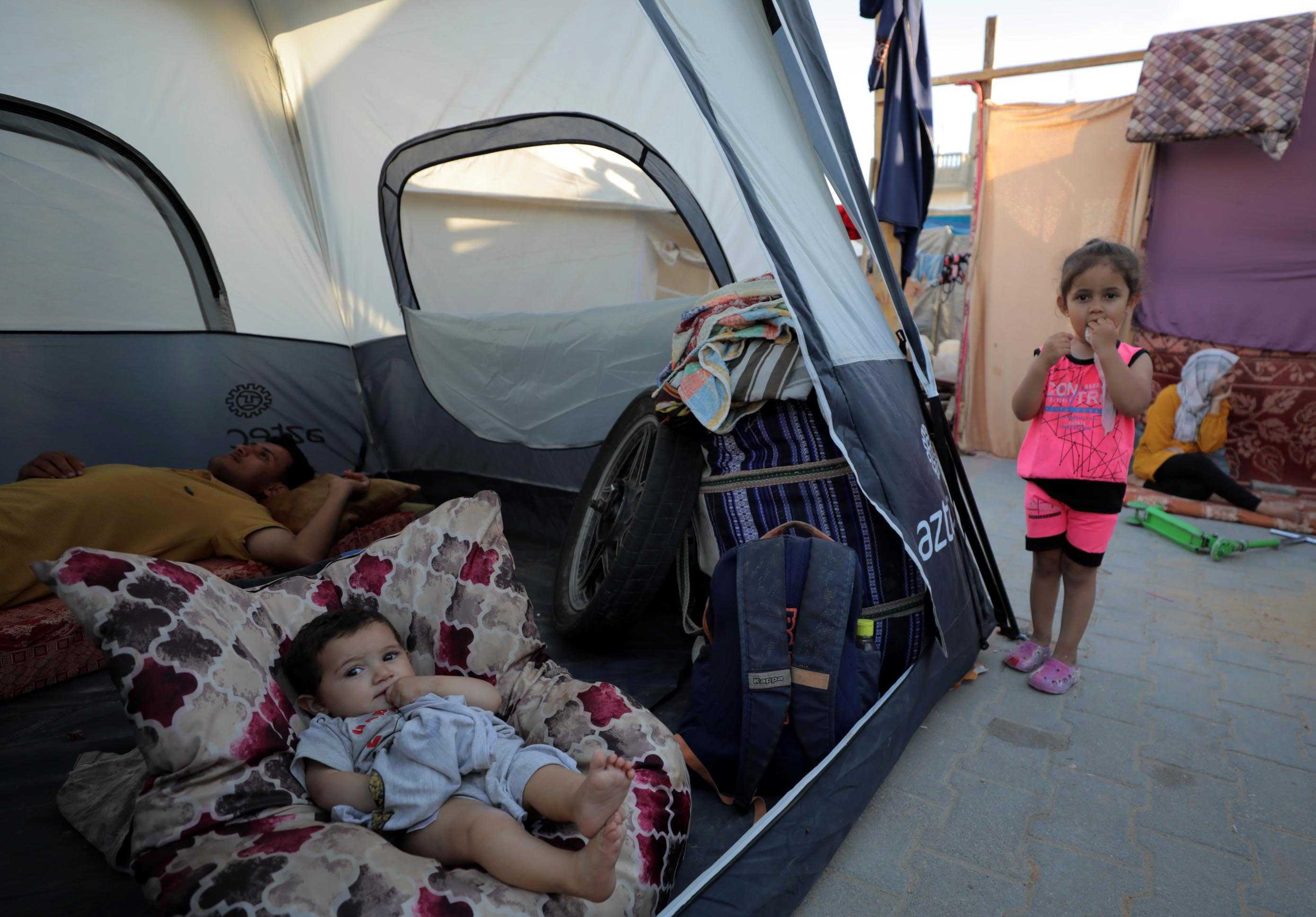 İsrail'in Refah'taki Katliamı: İnsanlık Dramı Yaşanıyor 2 AA 20240515 34568534 34568515 GAZZEDE GUNLUK YASAM SAVASIN GOLGESINDE DEVAM EDIYOR